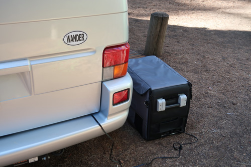 Photo of Dometic refrigerator plugged in at campsite
